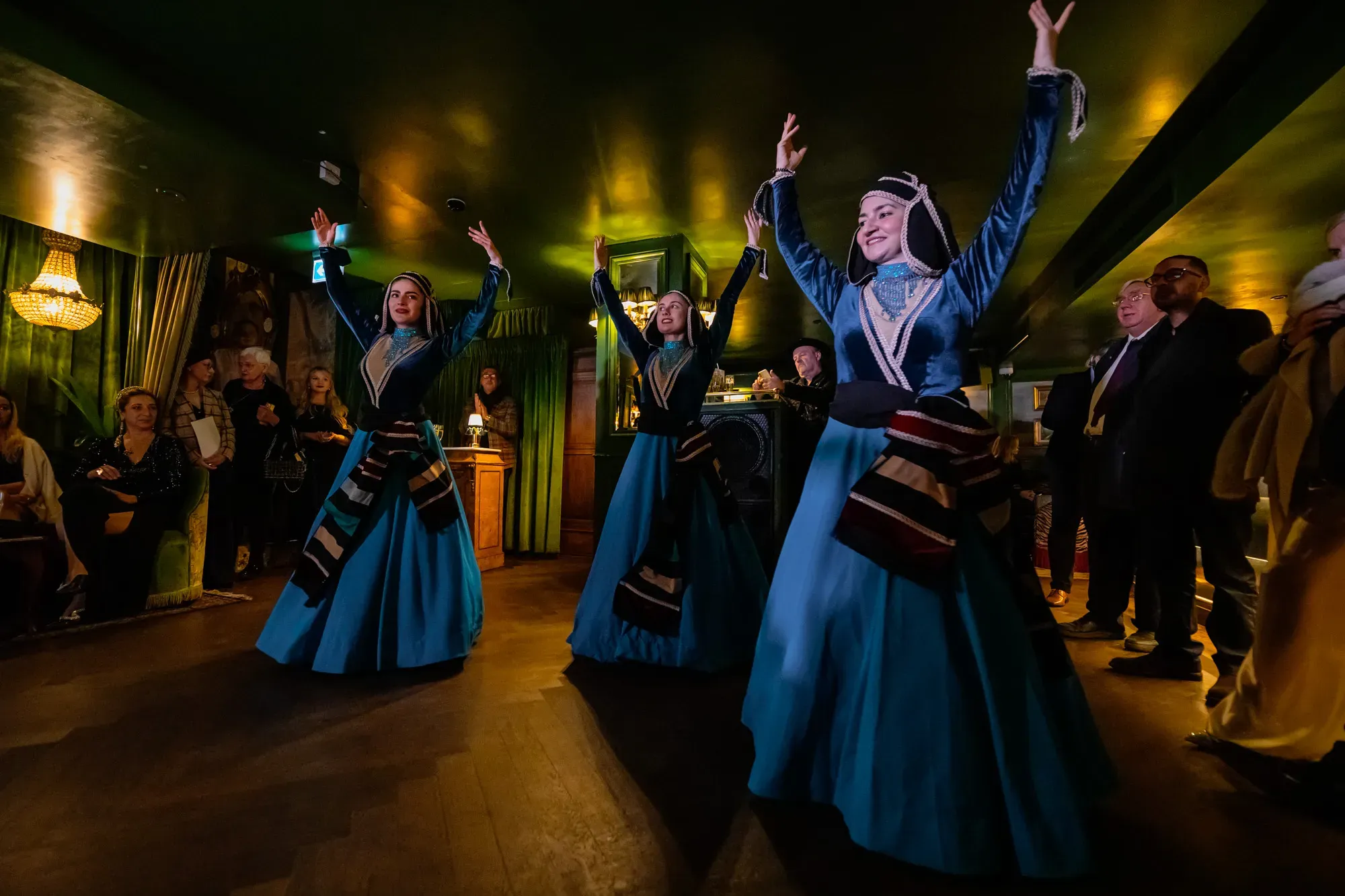 Dancers in traditional blue Caucasian costume perform for guests at SIFFA 2024