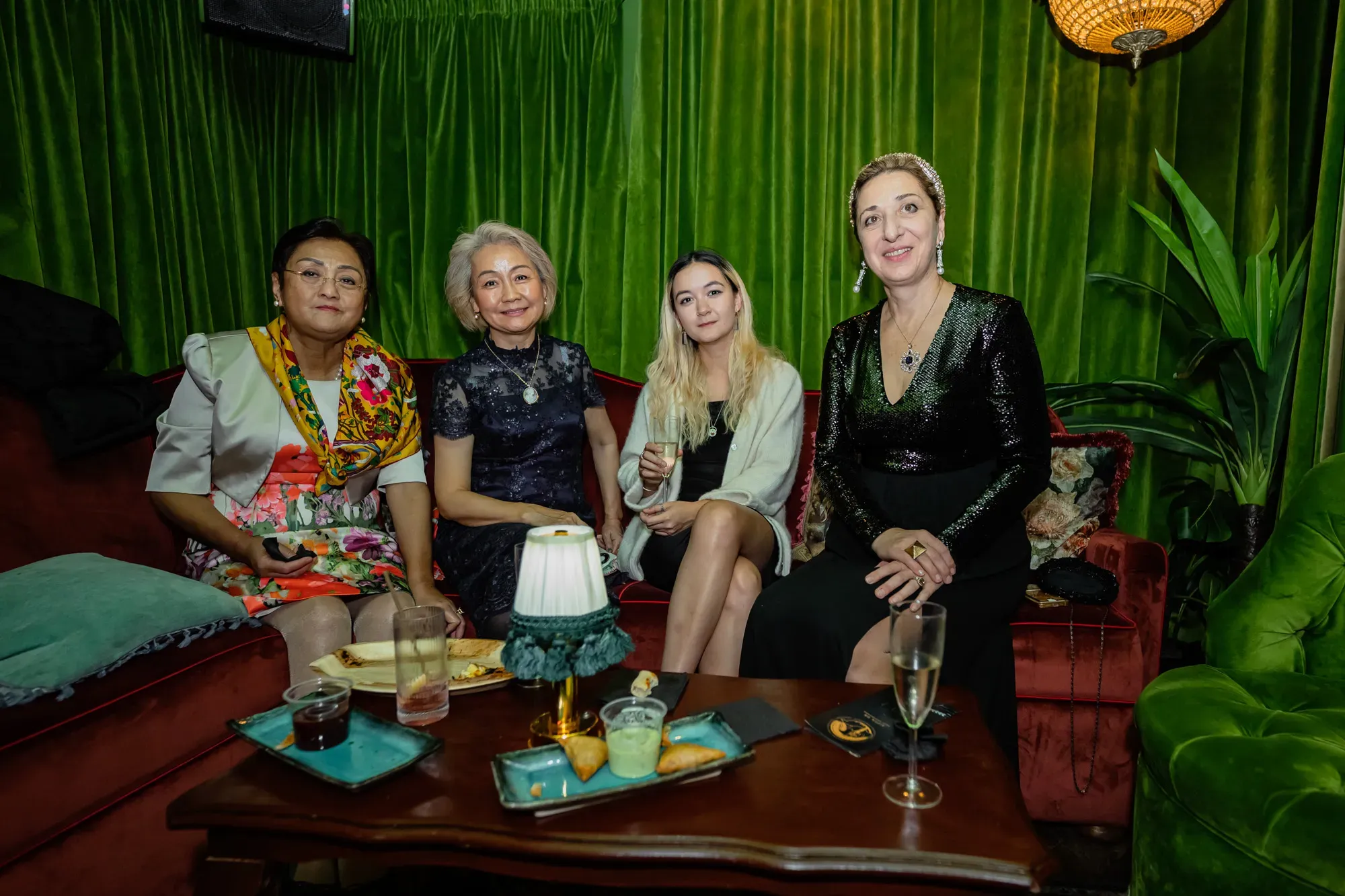 Guests at the SIFFA 2024 reception, seated on a velvet sofa